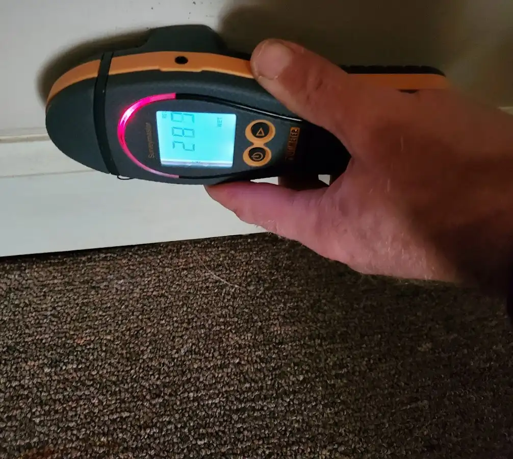 Moisture detection at baseboard during Storm Damage Restoration in Guntersville